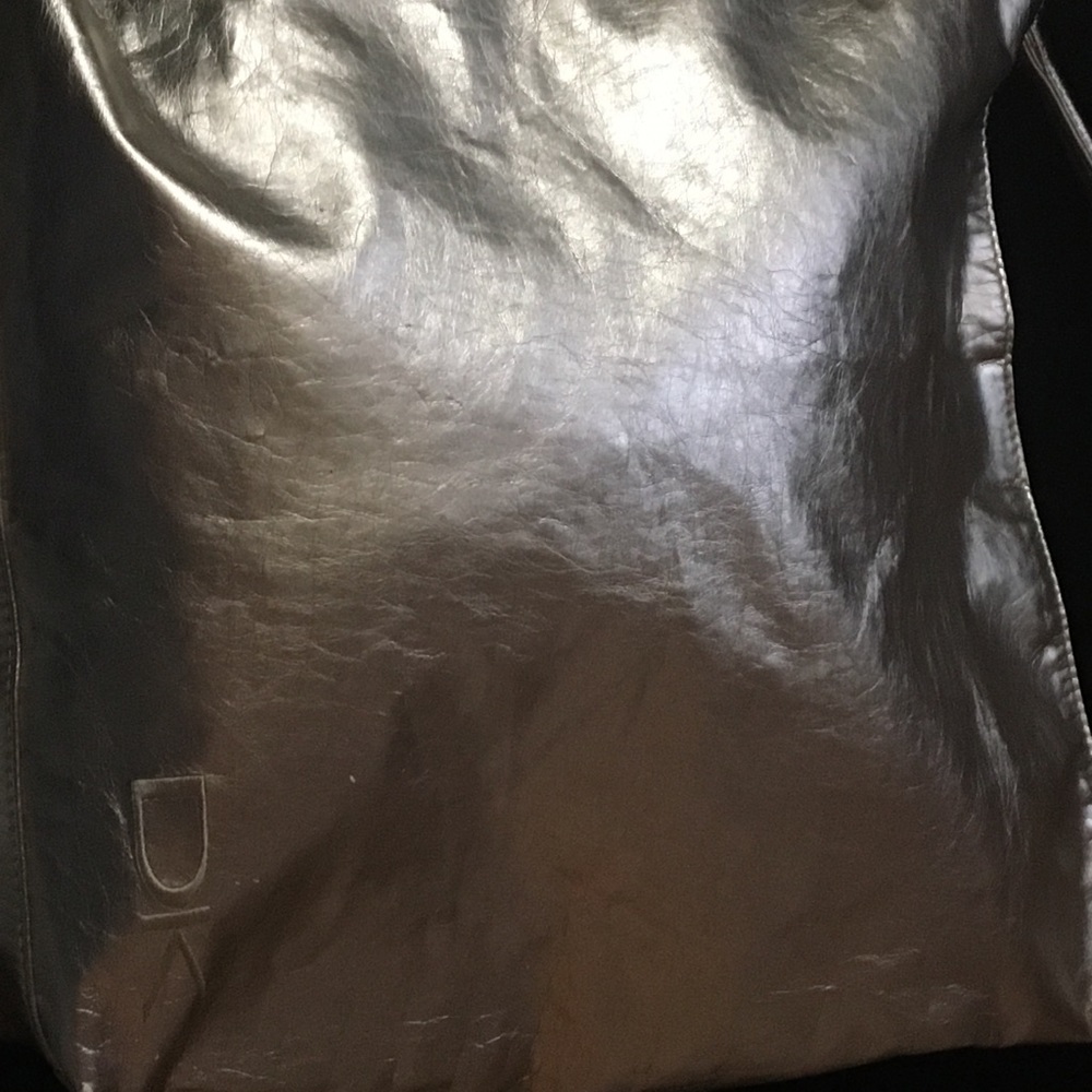 Donna Karan metallic gold cosmetics tote bag.